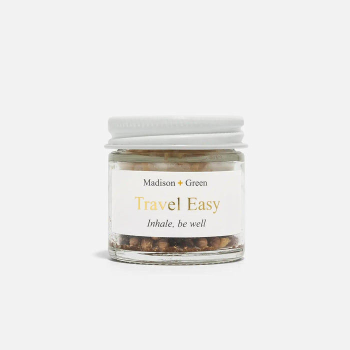Clear jar aromatherapy inhaler with white lid and Madison+Green Travel Easy label