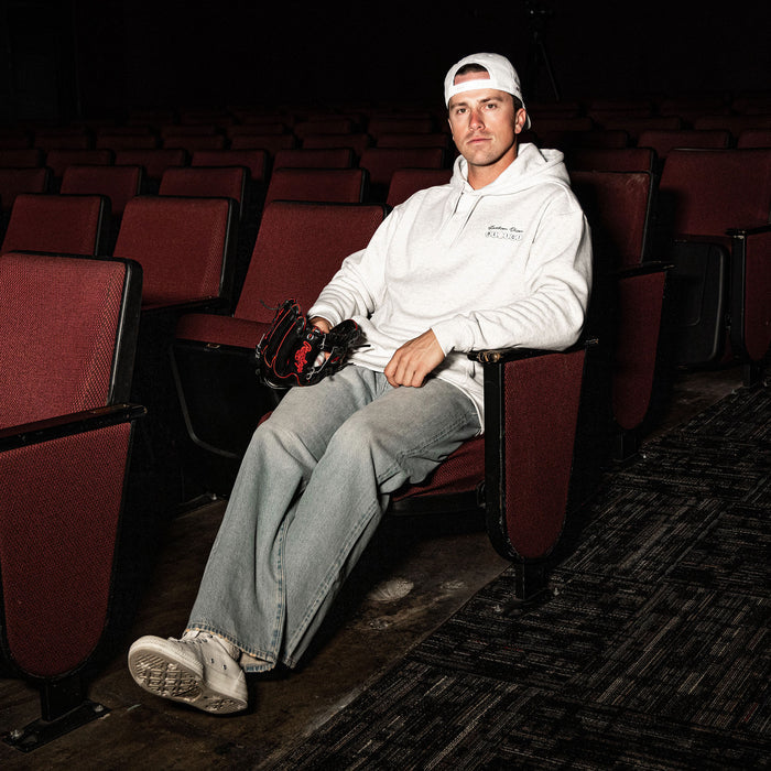 Adult model wearing gray hoodie with “BSBL Era” design