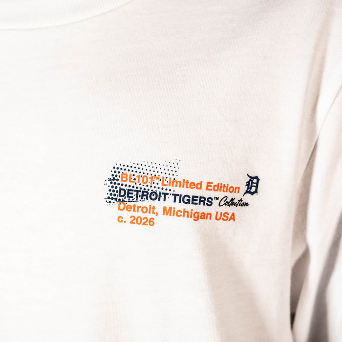 Adult model wearing white graphic tee with "Detroit Tigers Drip" design