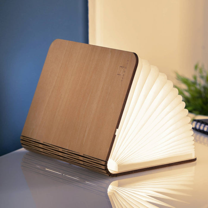 Natural Wood Smart Book Light by Gingko Design, a sleek lamp with a wooden finish designed for reading and ambient lighting.