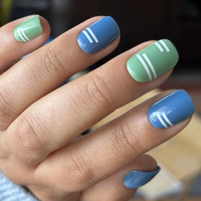 Sporty Stripes - Press-On | Extra Short | Squoval with mixed blue and green nails featuring crisp white sporty stripes for easy mani