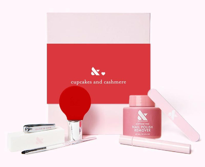 The O&J Mani System - 1 Polish with acetone-free remover, nail file, clipper, and manicure tools in pink and red packaging