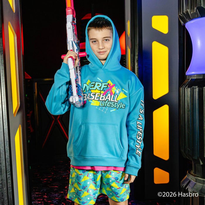 Child wearing a blue hoodie with 'NERF x Baseball Lifestyle' text, holding a toy baseball bat, in front of colorful background.