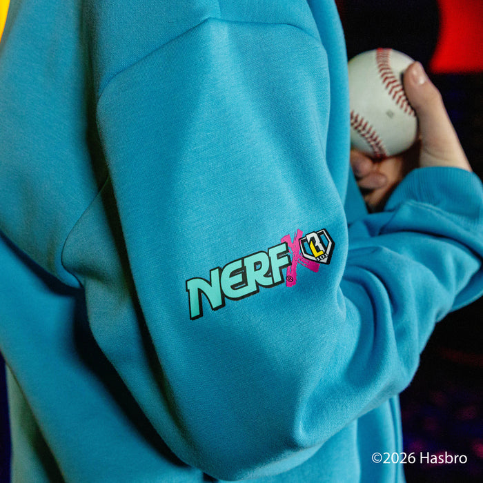 Person wearing a blue hoodie with a NERF x BL101 logo, holding a baseball.