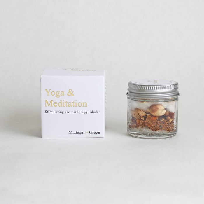 Aromatherapy inhaler jar with Yoga & Meditation scent, next to matching product box