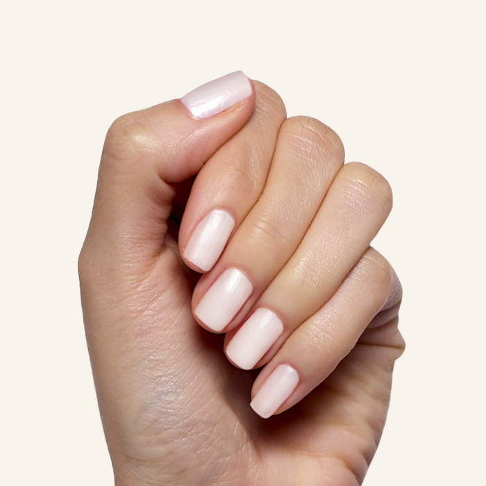 Atlas - Gel on natural nails showing a smooth, pearly white finish for an elegant manicure by Olive and June