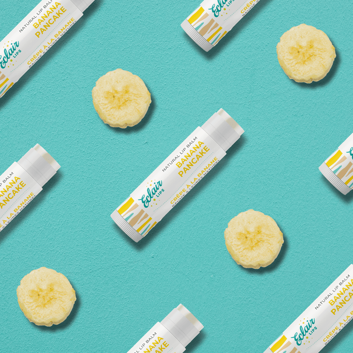 Flatlay of Banana Pancake lip balm and banana slices