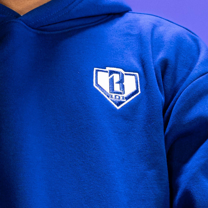Adult model wearing blue Baseline hoodie