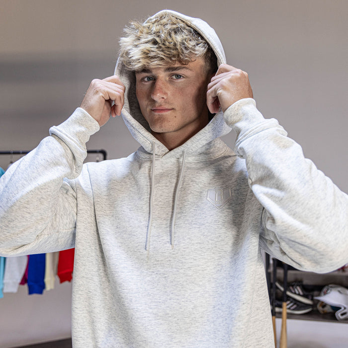 Adult model wearing gray Baseline Heather Gray hoodie
