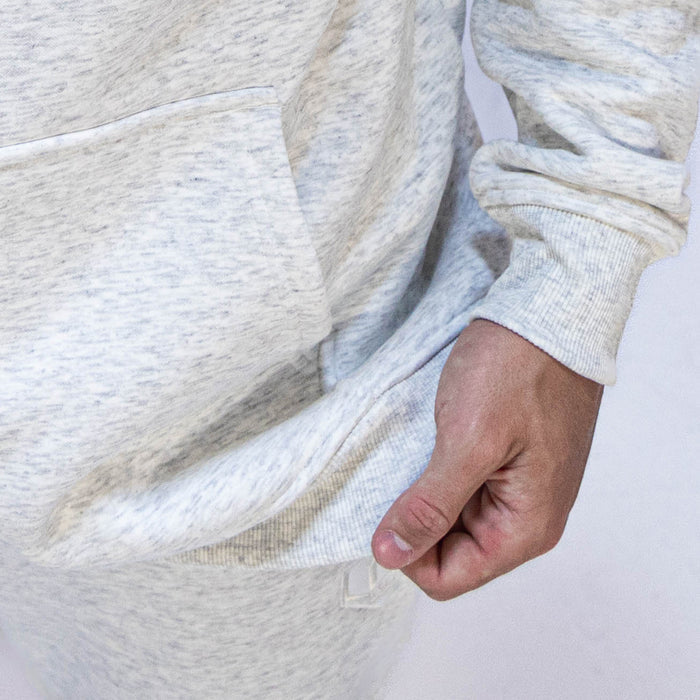 Youth model wearing gray Baseline Heather Gray youth hoodie
