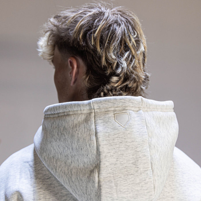 Youth model wearing gray Baseline Heather Gray youth hoodie