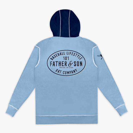 Flat lay back view of the adult columbia blue BL101 Bat Co Hoodie showing the Father & Son Bat Company oval graphic and navy contrast hood with white contrast stitching.