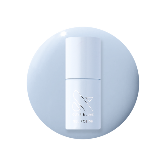 BP - Gel bottle on pastel icy blue background representing a smooth, long-lasting gel polish by Olive and June