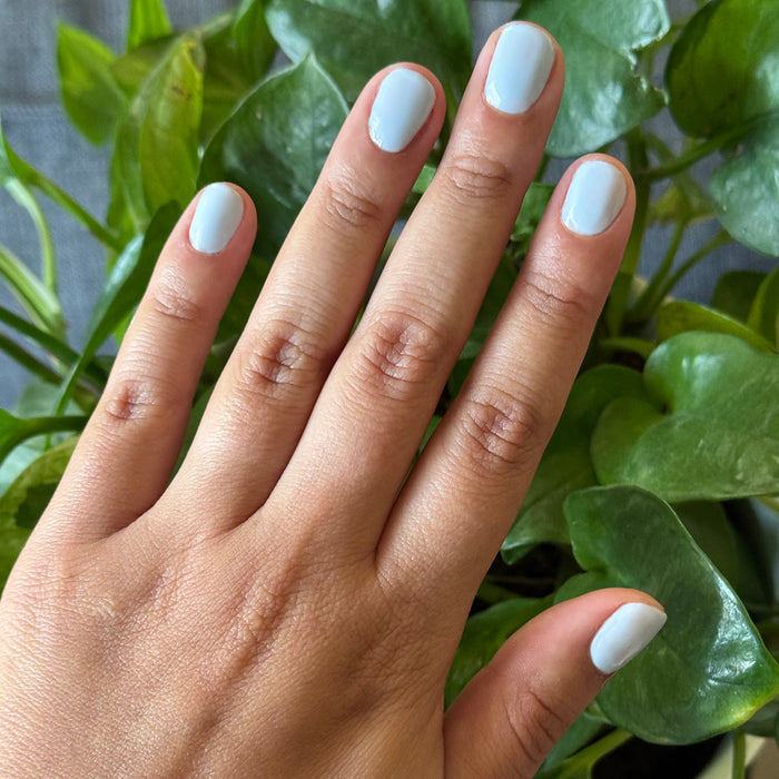 BP - Gel shown on nails painted in a soft icy blue for a smooth, long-lasting gel manicure by Olive and June