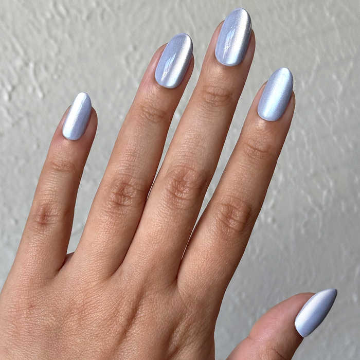 BP Velvet | Medium | Oval - Tab Press-On nails with soft icy blue pearl finish in a medium oval false nail press-on mani