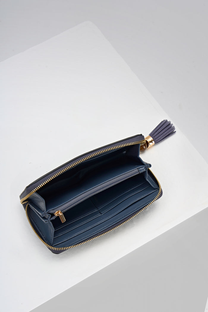 Inside of Capriana Denim Blue faux leather Large Purse with the zip open showing the inside card slots and coin holder zip pocket