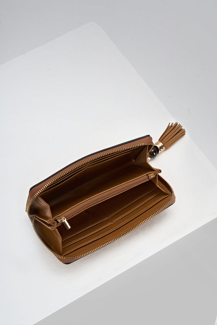 Inside of Capriana Tan faux leather Large Purse with the zip open showing the inside card slots and coin holder zip pocket