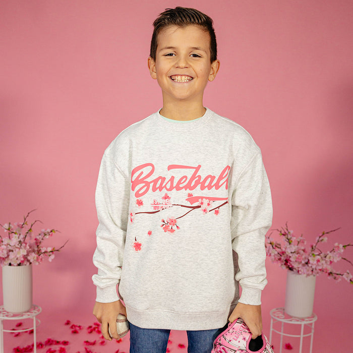Youth model wearing gray youth crewneck with “Cherry Blossoms Established” design