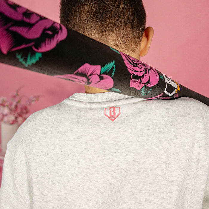 Youth model wearing gray youth crewneck with “Cherry Blossoms Established” design