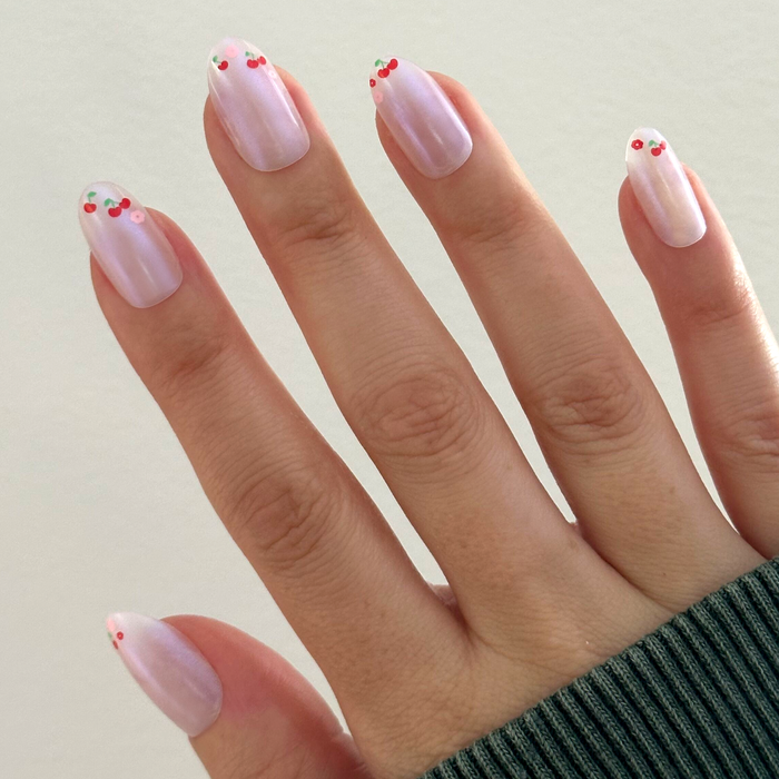 Cherry Floral Chrome French - Press-On | Medium | Oval with pearly chrome base and cherry accents at tips on natural hand