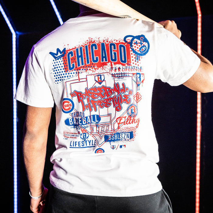Adult model wearing white graphic tee with "Chicago Cubs Drip" design