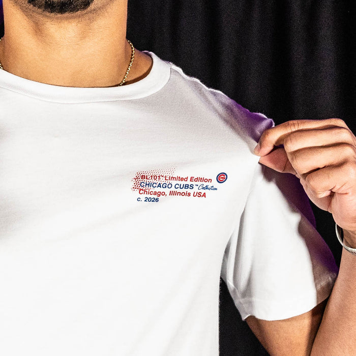 Adult model wearing white graphic tee with "Chicago Cubs Drip" design