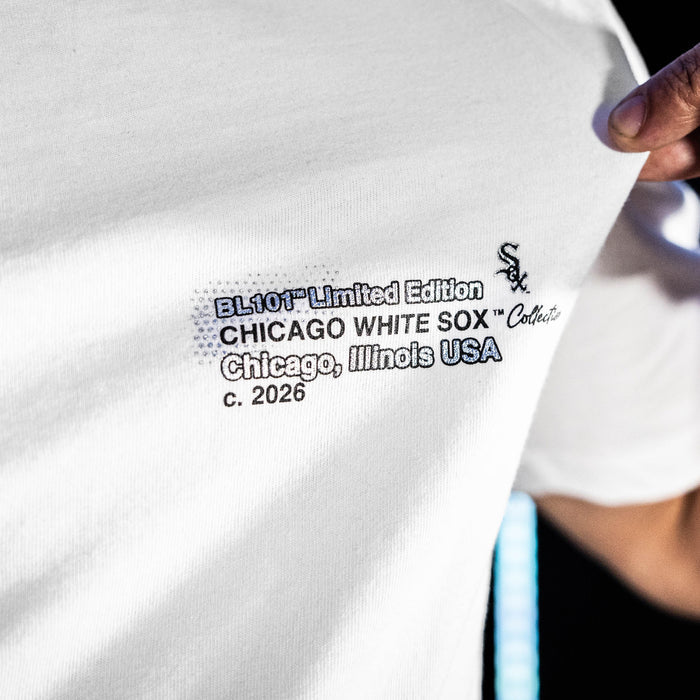 Adult model wearing white graphic tee with "Chicago White Sox Drip" design