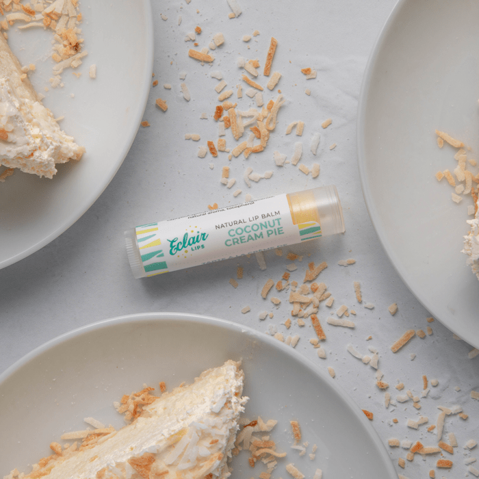 Eclair & Lips Coconut Cream Pie Lip Balm with dessert slices