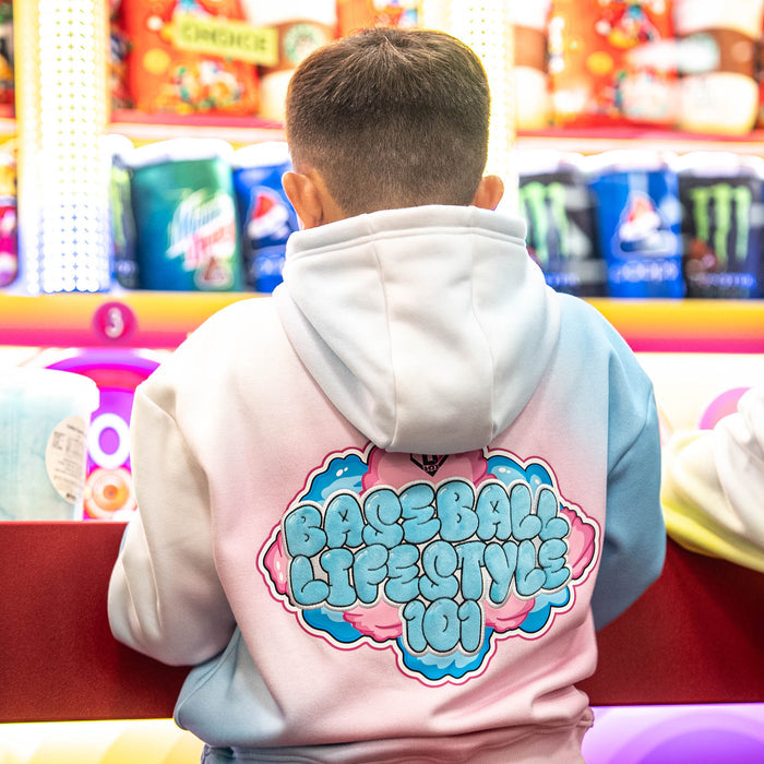 Person wearing a blue and pink hoodie with 'Baseball Lifestyle 101' logo