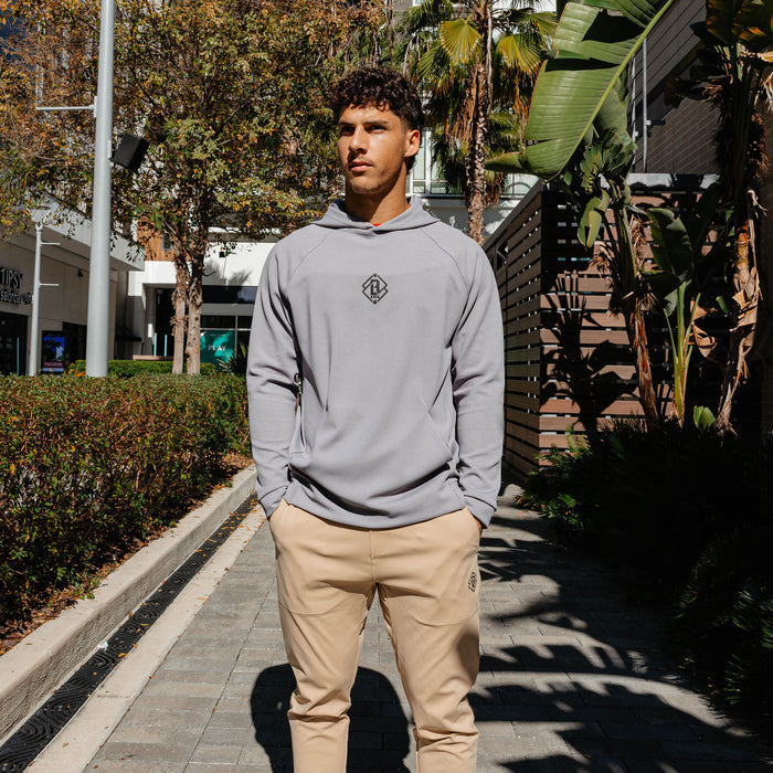 Youth model wearing gray Diamond Tech Jacquard youth hoodie