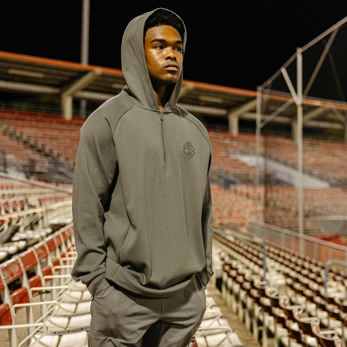 Adult model wearing gray Diamond Tech Knit Zip Charcoal hoodie
