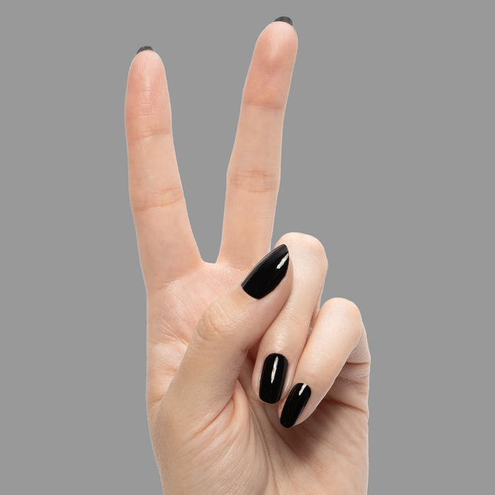 E+M - Gel shown on hand with deep black glossy nails for a sleek, long-lasting gel polish manicure by Olive and June