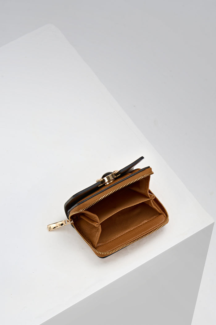Inside of Erin Tan Small Faux Leather Purse by Luella Grey which is unzipped showing the coin slots inside
