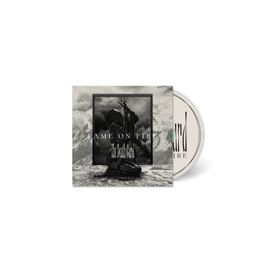 CD cover featuring a black and white image of a statue-like figure kneeling on rocky ground with mountains behind. Text reads FAME ON FIRE and The Death Card, evoking a sense of nightmare. The partially visible CD is included.