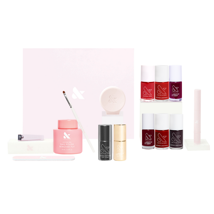 Fave Reds Mani System with six red nail polishes, cuticle serum, remover pot, cleanup brush, and manicure tools for at-home use
