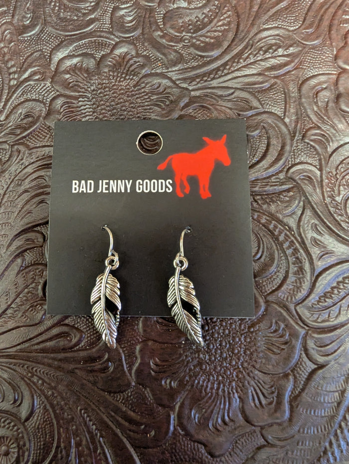 Silver feather earrings from BadAssBabe featuring lightweight, detailed feather design for boho or casual styles.