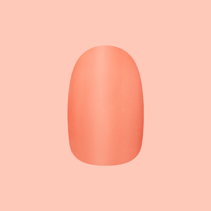 Frolic | Extra Short | Round - Tab Press-On nail in bright orangey coral for easy at-home mani application