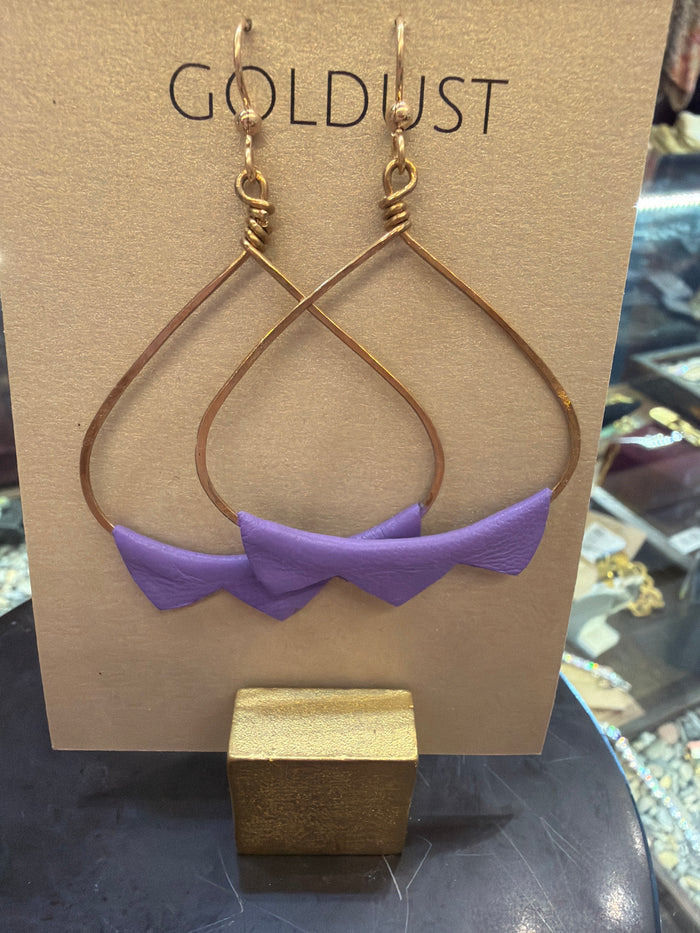Goldust Jewelry GD Leather Earrings featuring stylish, handcrafted leather earrings with gold accents on a neutral background.