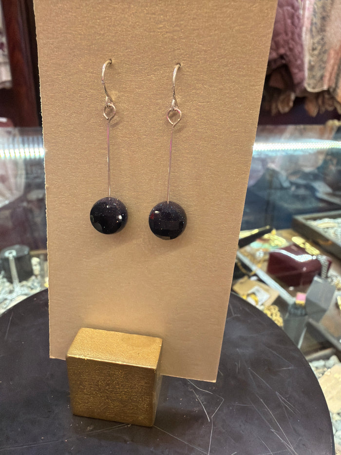 Goldust Jewelry GD semi-precious stone earrings featuring colorful gemstone drops and gold-tone hooks.