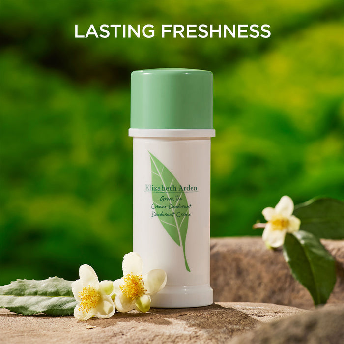 Green Tea Cream Deodorant on a natural background with flowers. It has lasting freshness.