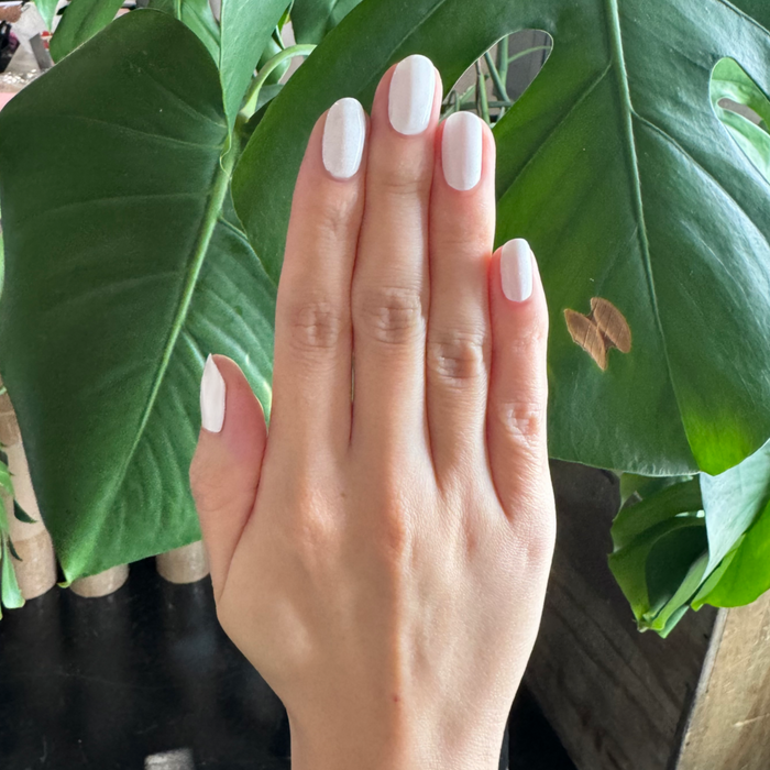 HD - Gel on natural nails showing smooth, soft white polish for a clean, long-lasting at-home manicure look