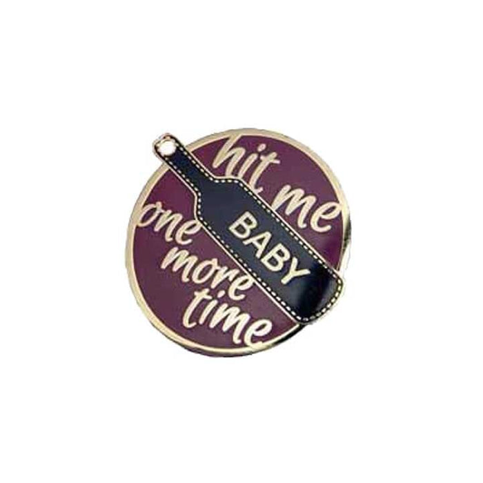 enamel pin with paddle and the phrase hit me baby one more time