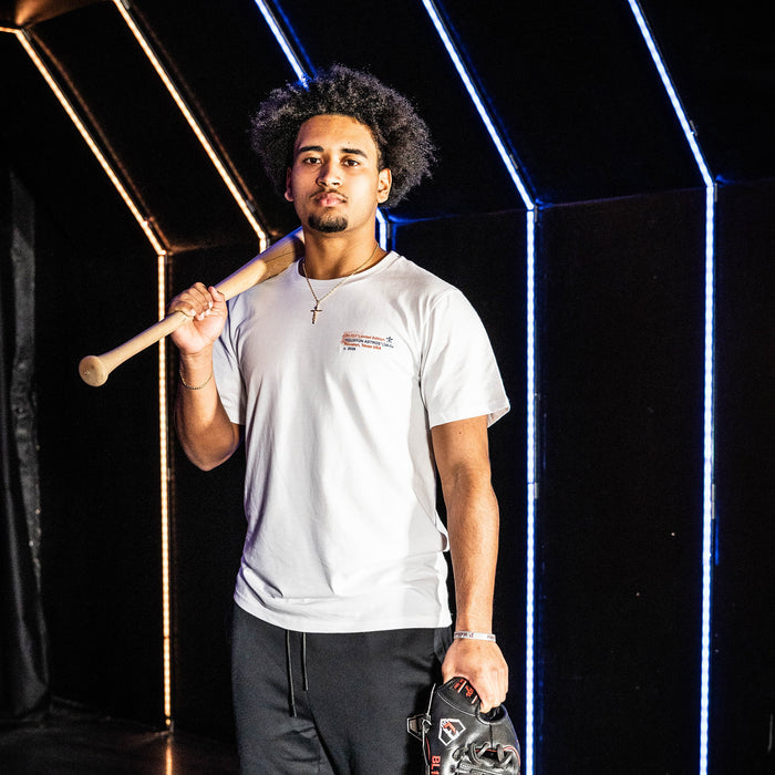 Adult model wearing white graphic tee with "Houston Astros Drip" design