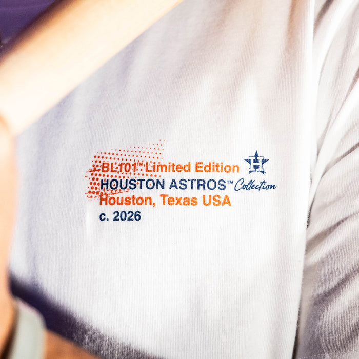 Adult model wearing white graphic tee with "Houston Astros Drip" design