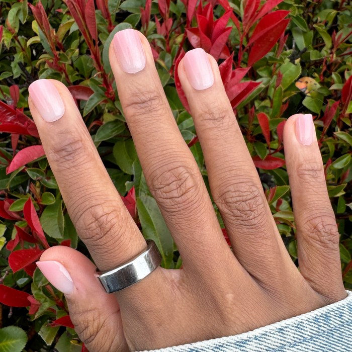 HZ Syrup Gradient - Press-On | Extra Short | Squoval showing hand with extra short squoval nails in rosey-beige gradient mani outdoors
