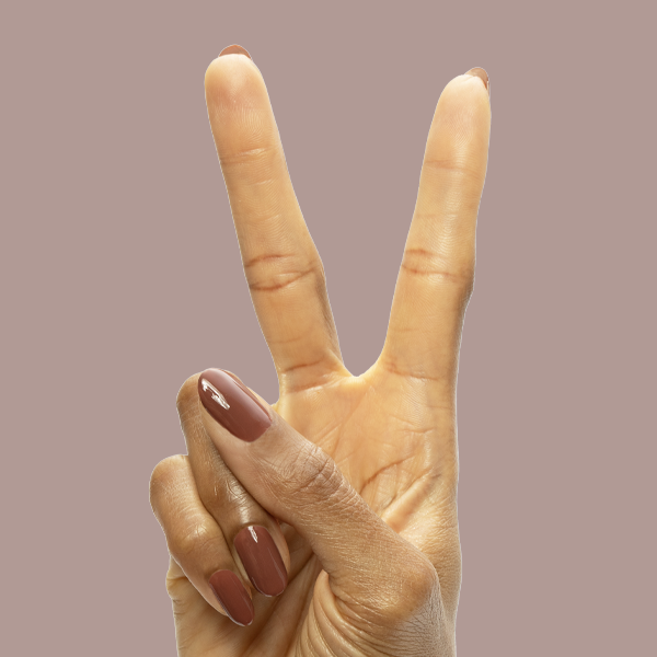 JJ - Gel on natural nails in a smooth cinnamon brown shade for a cozy, long-lasting mani by Olive and June