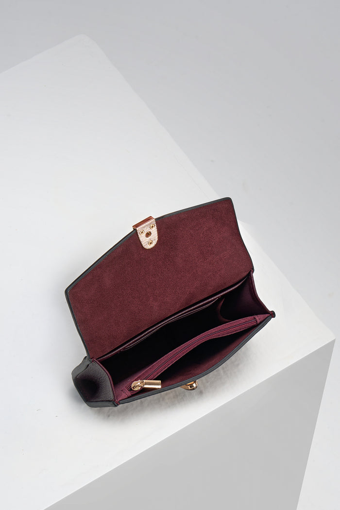 Inside of Leontina Black Cherry  Medium Purse showing the zip top coin compartment and interior card slots