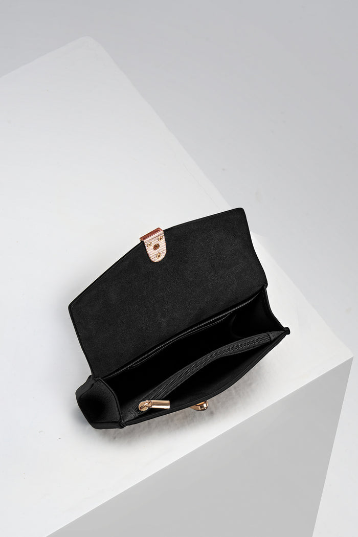 Inside of Leontina Black Medium Purse showing the zip top coin compartment and interior card slots
