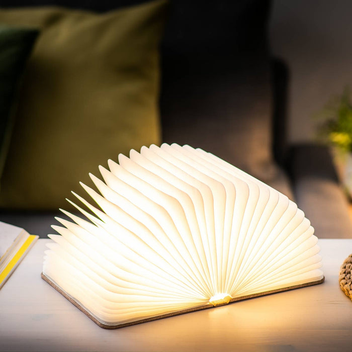 Gingko Design linen fabric smart book light lamp with soft LED illumination and elegant linen cover, designed for reading and ambiance.