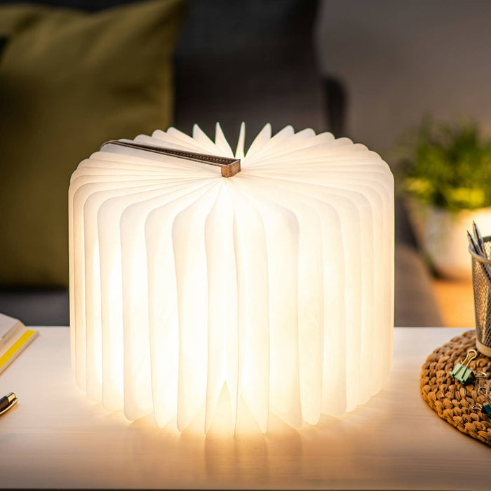 Gingko Design linen fabric smart book light lamp with a soft, textured linen shade and adjustable arm for reading illumination.